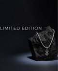 Berserk Necklace with a unique pendant on a dark rock, labeled 'Limited Edition' on a black background.