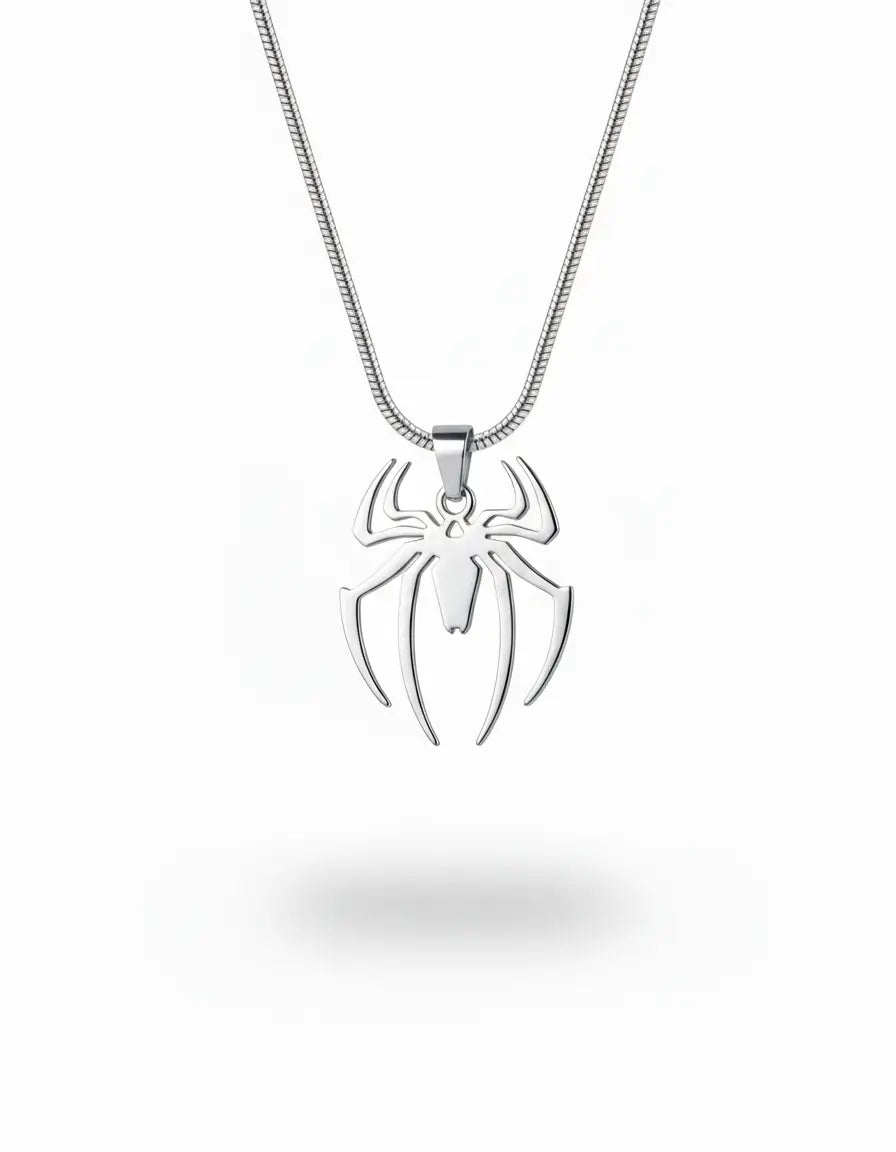 A silver spider pendant necklace on a matching silver chain, shown against a plain white background with a soft shadow underneath.